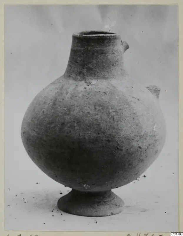 Plain white pottery vessel with a rounded body, narrow neck and small lug handles, from Amathus