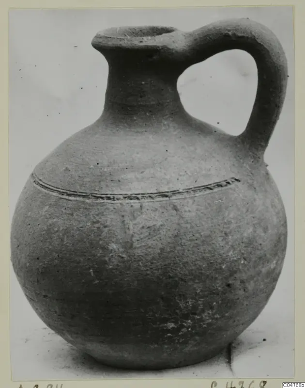 Jug, Pottery Plain White IV-V, from Amathus, with a tall neck, one strap handle and incised lines on the shoulder.