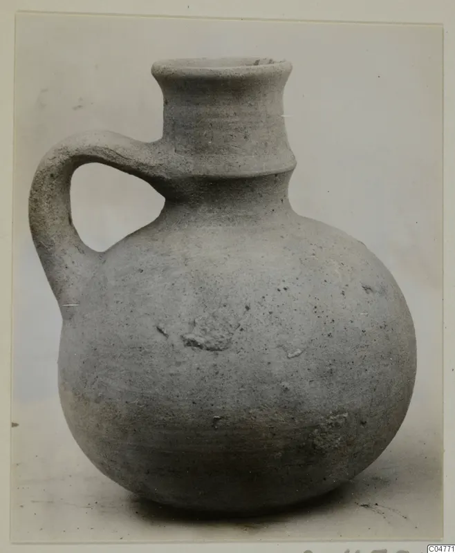 Pottery jug with a single loop handle and a tall flaring neck, from Amathus