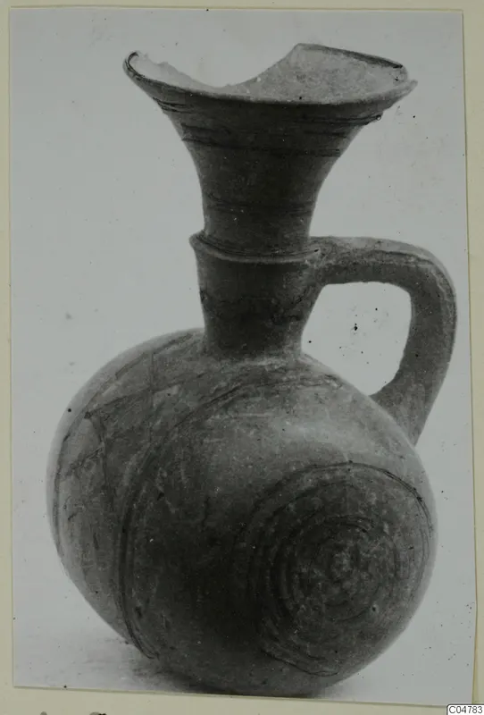 Pottery Black-on-Red I-III jug from Amathus, tombs 1–9, with a flaring mouth and strap handle