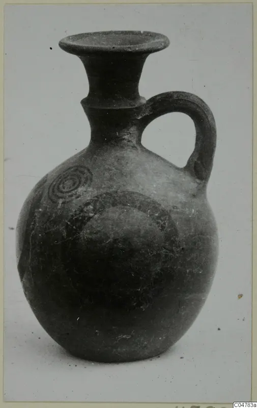 Pottery jug with a single loop handle and concentric circle decoration in dark paint, from Amathus tombs 1–9.