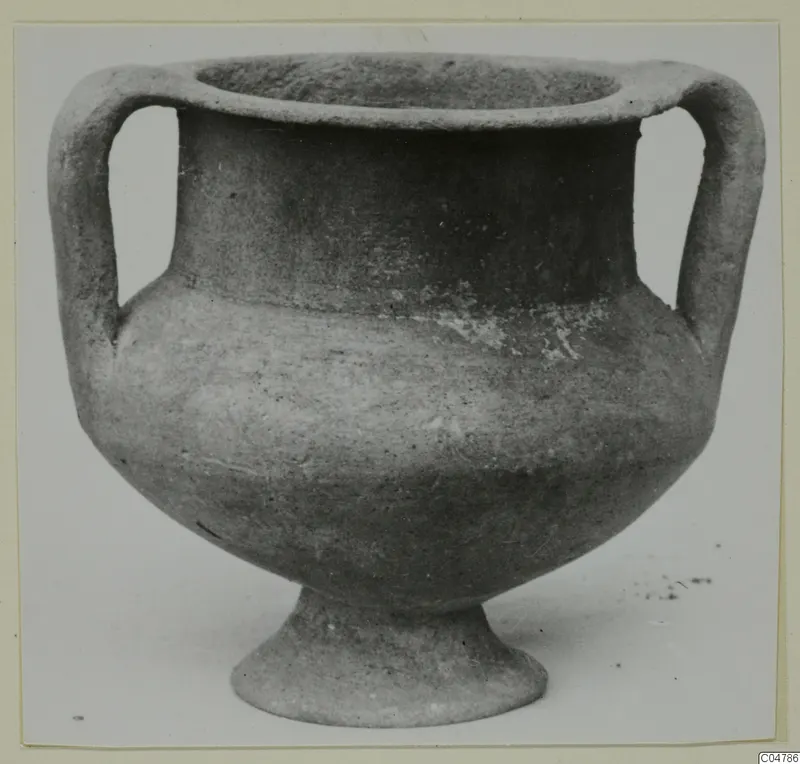 Two-handled grey polished pottery vessel on a pedestal foot, from Amathus