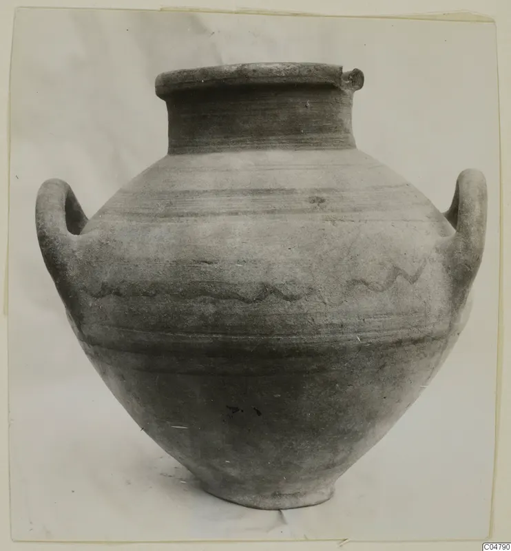 Two-handled pottery jar, White Painted IV, from the Amathus tombs, with horizontal bands and a wavy line on the body.