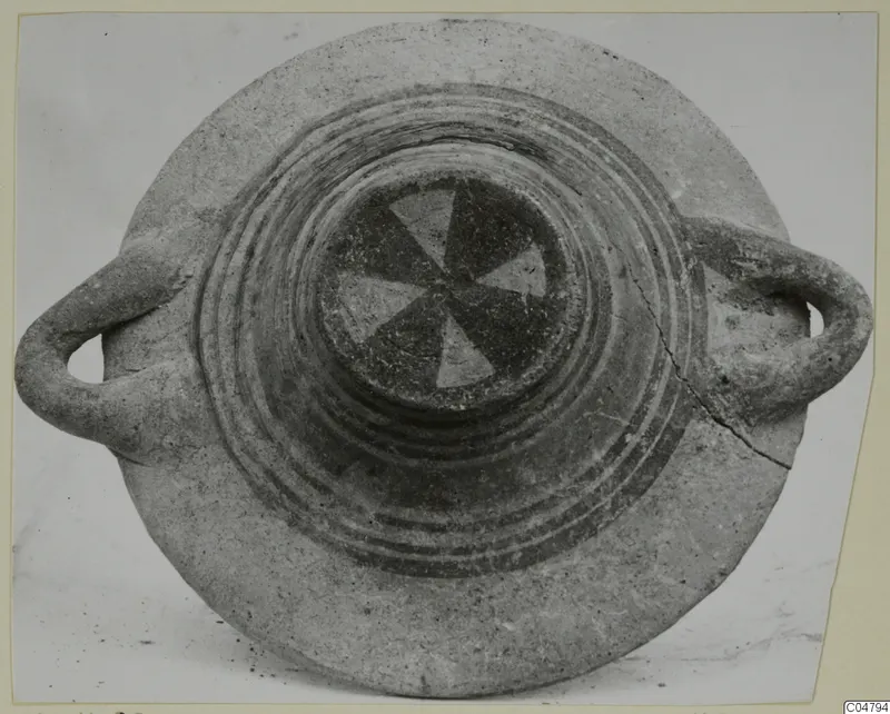 Pottery Bichrome III vessel from Amathus, seen from above, with two loop handles and a pinwheel pattern in the centre