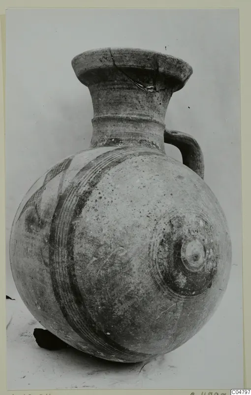 Pottery Bichrome I vessel from Amathus: round-bodied jug with dark painted bands and a loop handle.