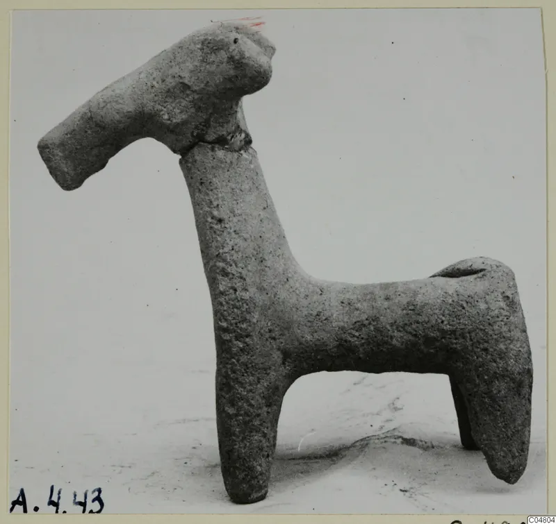 Small clay figurine of a four-legged animal with a long neck and head, from Amathus