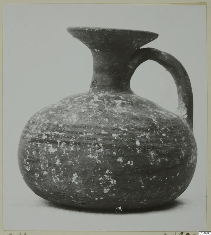 Round-bodied jug with a flared mouth and single loop handle, from the painted pottery series