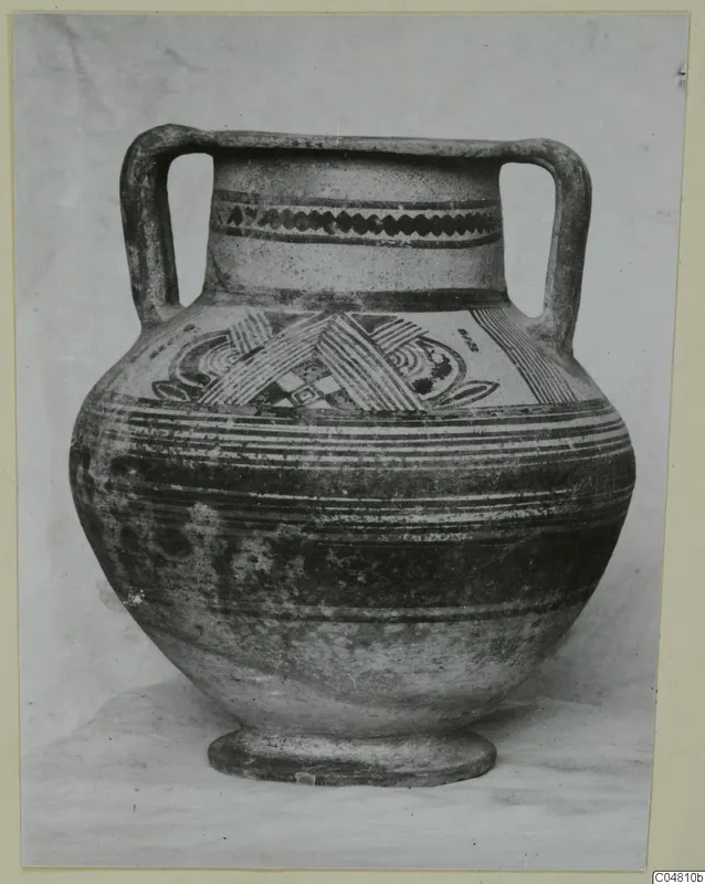 Two-handled painted pottery amphora-crater, photographed against a plain backdrop