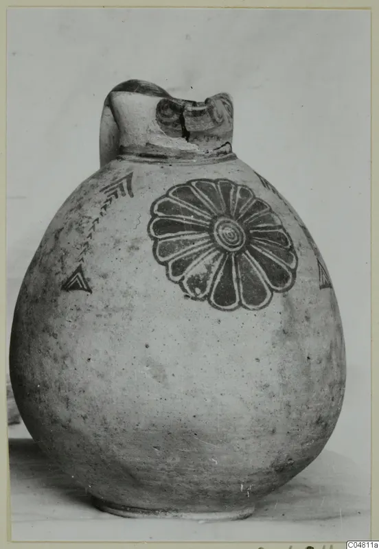 Round-bodied jug with a broken neck, painted with a large rosette of petals and chevron motifs