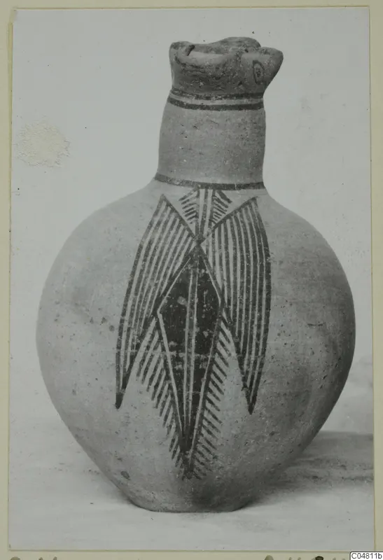 Bichrome IV jug with a round body, dark painted neck bands and a large hatched leaf-and-lozenge motif on the body