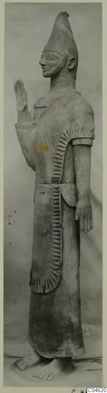 Terracotta statue of a standing bearded figure with a raised hand, Terracotta Proto-Cypriote II