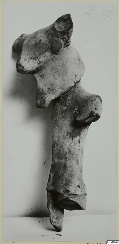 Terracotta Minor Plastic 2, a fragmentary terracotta figure with a head and a projecting arm-like part