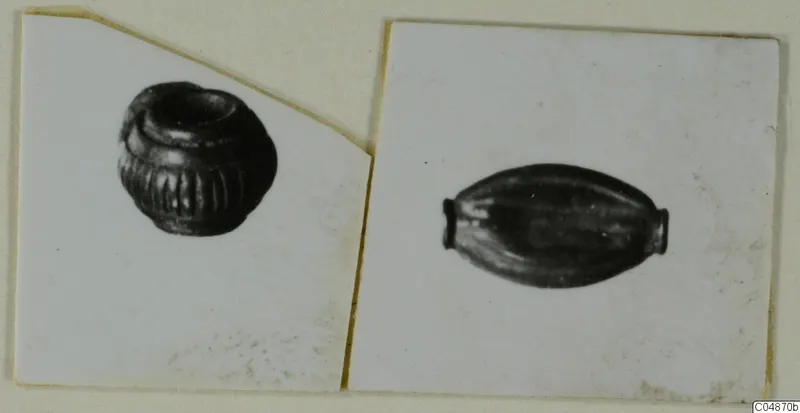 Two mounted photographs of small ridged beads, one squat and rounded, one elongated and barrel-shaped