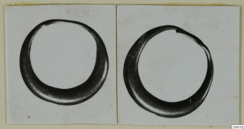 Two views of a thick hooped ring, mounted side by side on a card