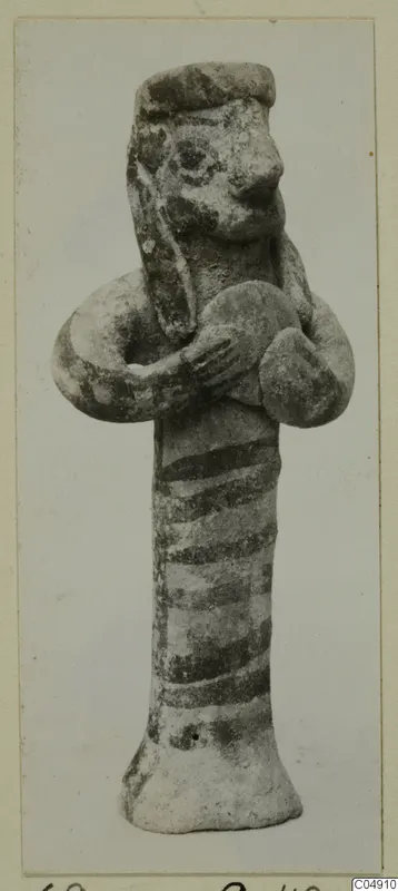 Clay figurine from Amathus with dark painted bands on its body and arms bent across the chest.