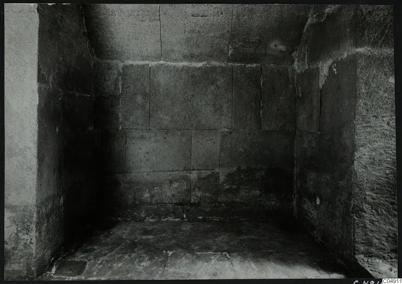Interior of a stone chamber at Amathus, with large rectangular blocks forming the walls and a flat stone floor