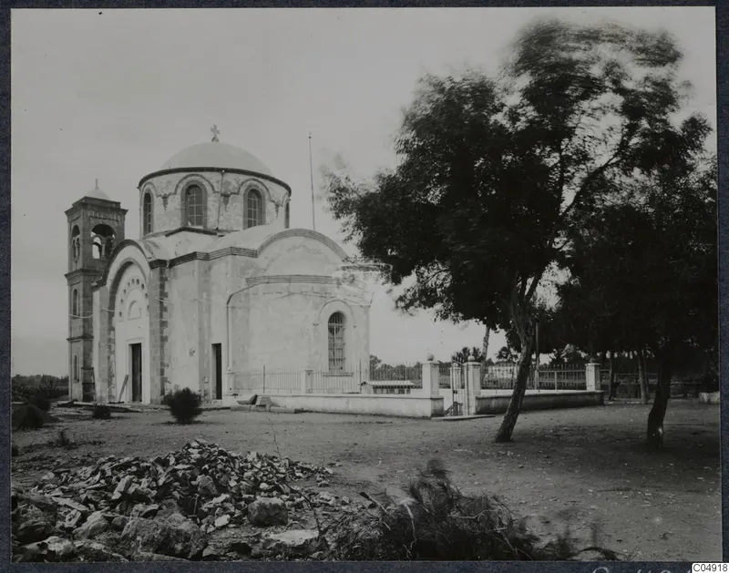Greek Orthodox church of Panagia Faneromeni in Kition, with a dome, bell tower and a tree at right.