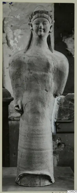 Terracotta Cypro-Greek I standing figure from Mersinaki I-II, with a headdress and cylindrical lower body