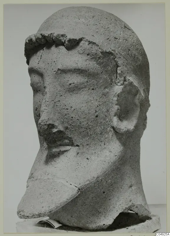 Head sculpture from Mersinaki with a curled band across the brow and a chipped nose.