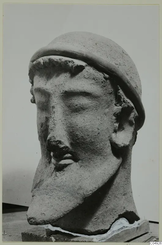Terracotta head of a bearded man wearing a rounded cap, from Mersinaki