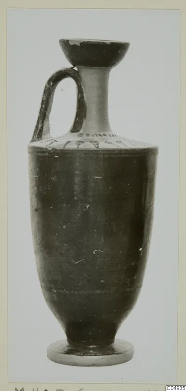 Black glazed pottery vessel with a single handle, flared mouth and ring foot, from Marion
