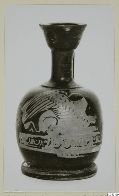 Small pottery vessel with a flared neck and a pale figured band with a winged animal on its body