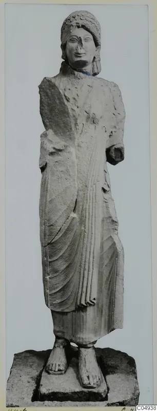 Limestone statue of a woman from Vouni, standing with arms at her sides, one forearm broken off