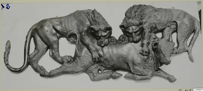 Bronze relief of two lions attacking a recumbent animal, from Vouni