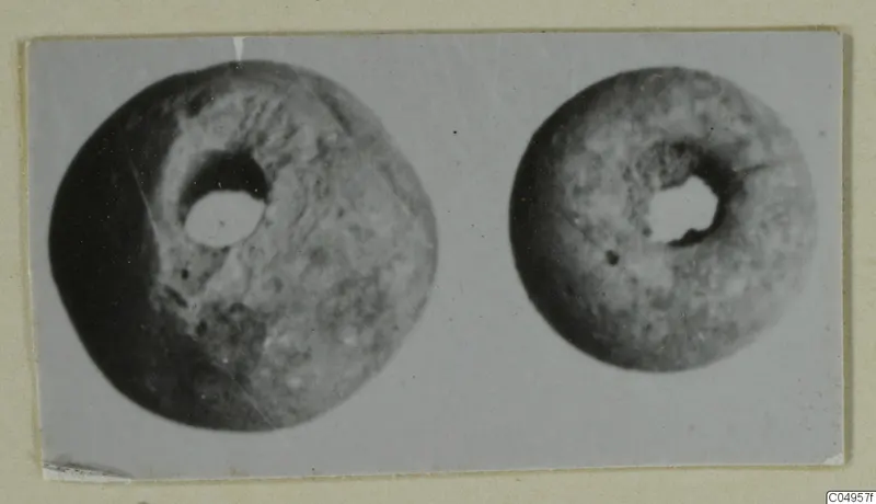 Two ring-shaped objects with central holes, one larger than the other, photographed side by side from Amathus