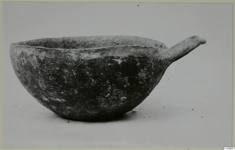 Pottery Black Slip Ware bowl from Milia with a single handle projecting to the side