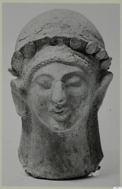Terracotta head with a band of rounded knobs across the top of the head, from Mersinaki