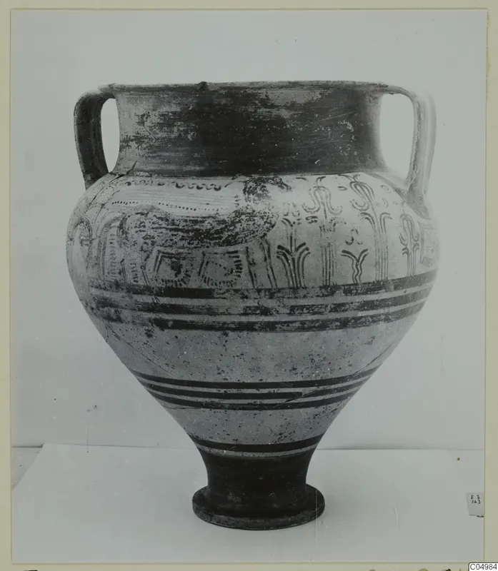 Two-handled painted pottery vessel with a wide mouth and a footed base, shown against a plain grey background.