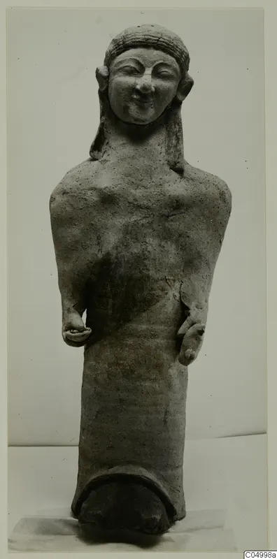 Terracotta Cypro-Greek figure from Mersinaki, standing with arms bent and hands at the waist