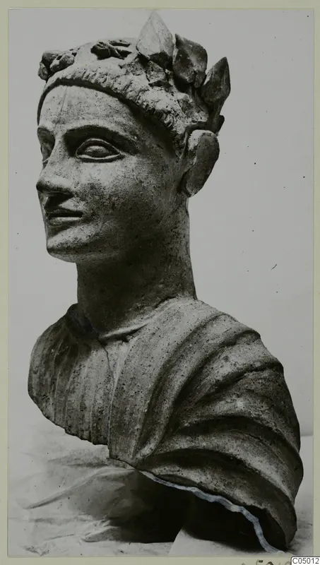 Terracotta bust of a male head wearing a wreath of leaves, turned toward the left
