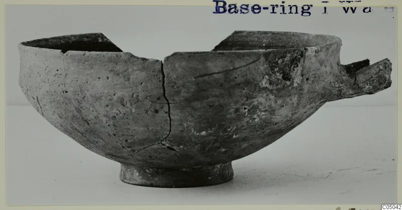 Pottery Base-Ring Ware bowl from Enkomi, broken, with a stub of handle on the right side