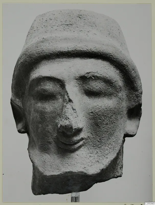 Head of a statue from Mersinaki with closed eyes, a flat-topped headdress and a prominent nose