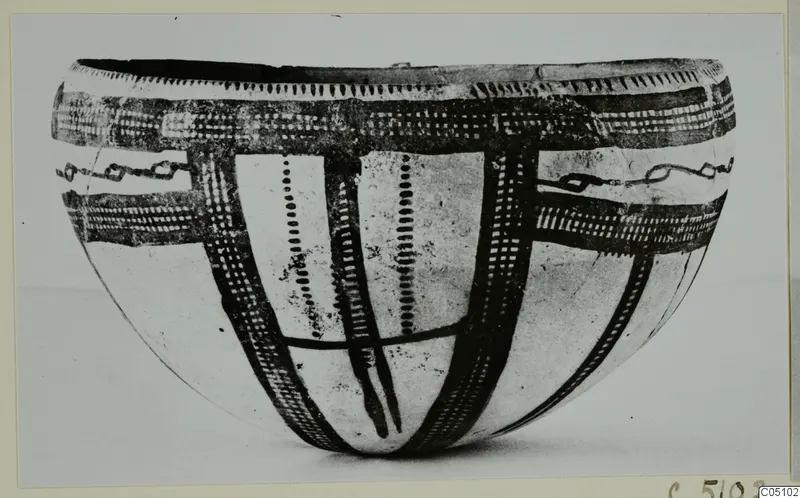 Bowl of White Slip Ware with dark painted bands, cross-hatching and dotted vertical lines
