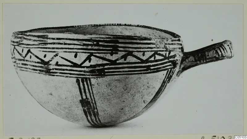 White Slip Ware bowl with a side handle and painted bands and zigzags, from Enkomi