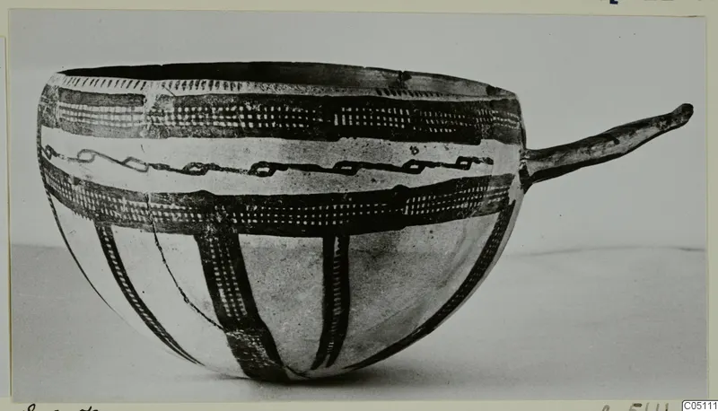 Pottery White Slip Ware bowl from Enkomi with a long side handle and dark painted bands