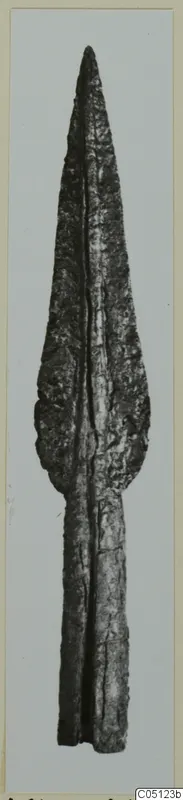 Spearhead of bronze from Amathus, shown upright against a plain grey background