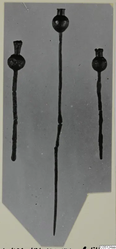 Three metal pins with globular heads from the Kastros tombs at Lapithos, on a grey mount