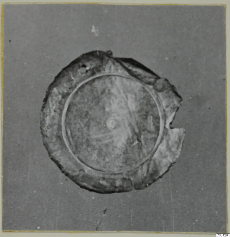 Circular sheet-gold jewellery piece from the Kastros tombs at Lapithos, with a raised ring and broken edge