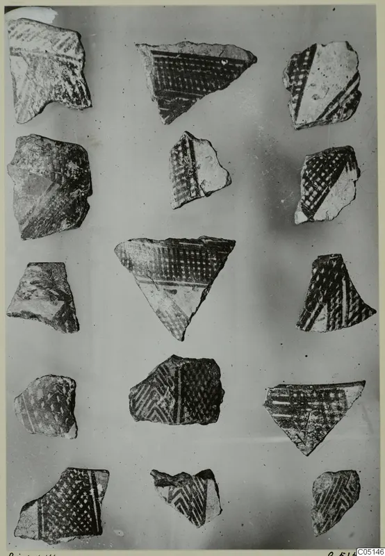 Grid of painted pottery sherds with dark geometric patterns on a light ground