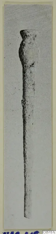Bone pin from Lapithos, Kastros tombs, shown upright against a pale background