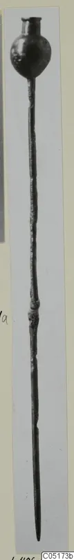 Long slender metal pin with a rounded knobbed head and a pointed tip, shown upright.