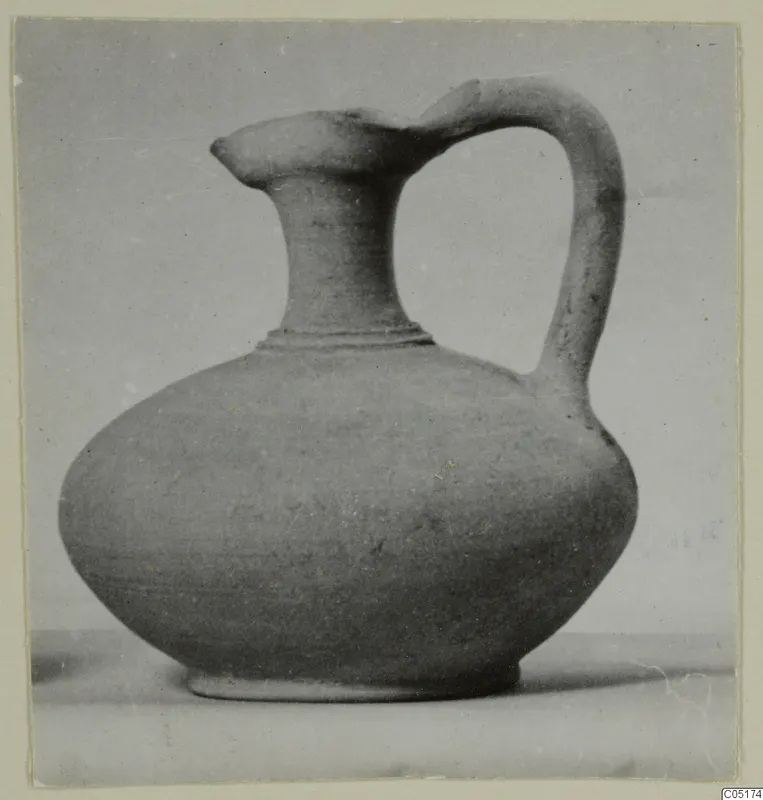 Pottery jug with a pointed spout and a single loop handle, from Kountoura Trachonia, Tomb 11.