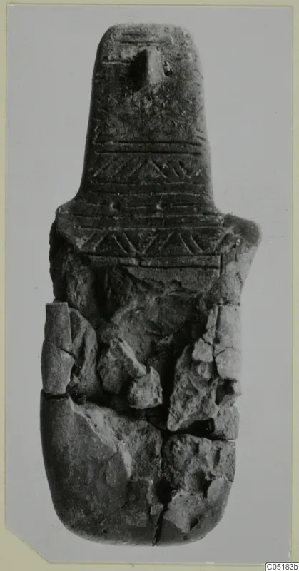 Idol, a broken object with a tapering neck and bands of incised chevrons and lines
