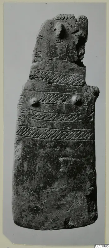 Idol from Lapithos: a flat upright clay figure with a pointed head and incised diagonal bands across the body