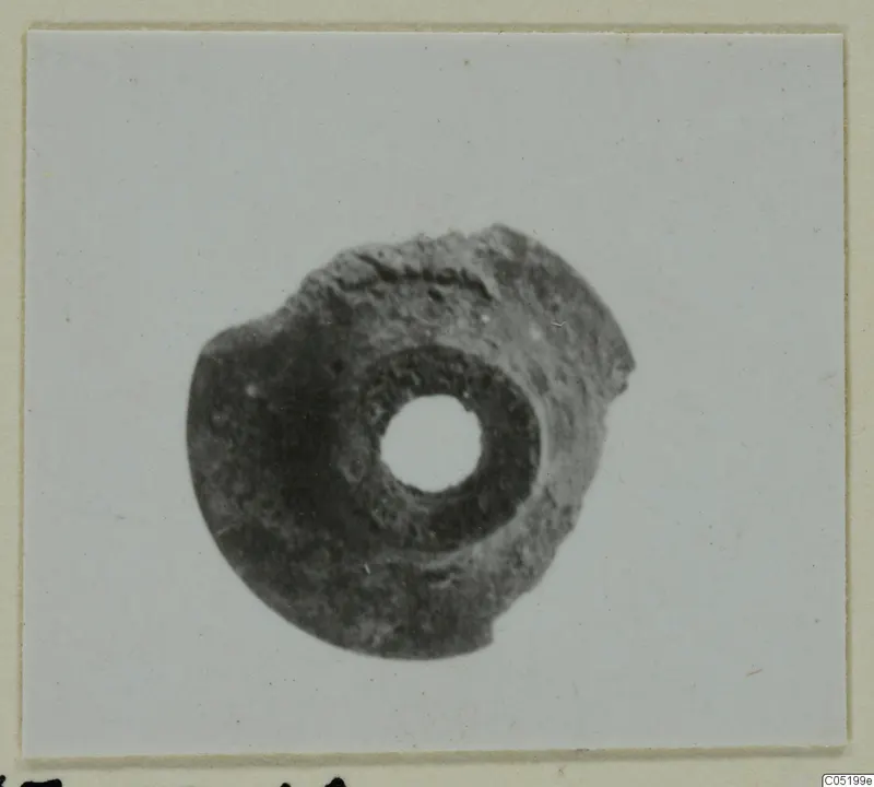 Disc-shaped object with a central hole, from Enkomi Tomb 16
