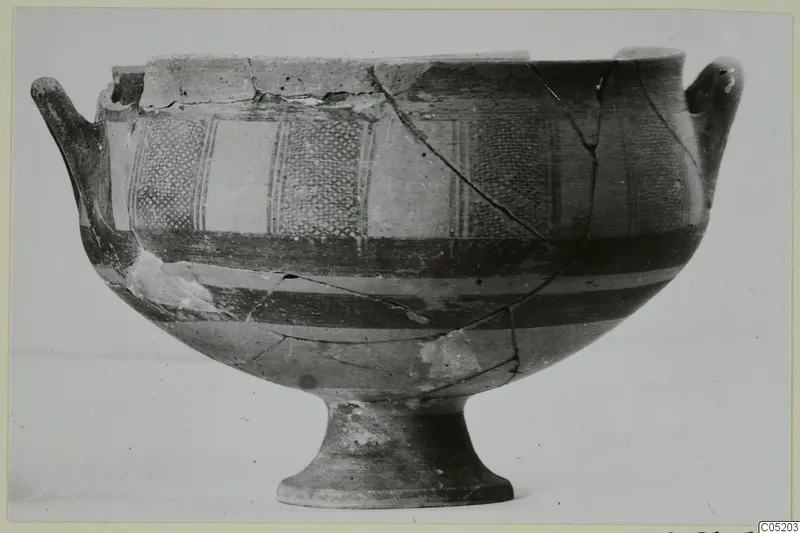 White Painted I bowl from Lapithos, with two handles, a footed base and painted bands and panels